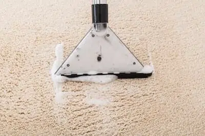 Máquina de extracción de agua para una moqueta compatible