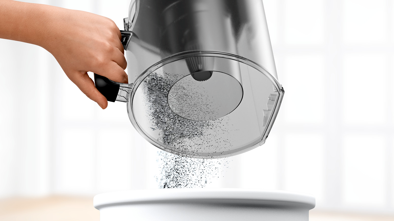 Depósito EasyClean de la Bosch Serie 6 BGS41K332 al vaciarse sobre una papelera